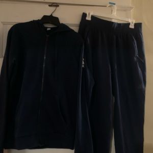 Navy blue Adidas sweatsuit with hood.